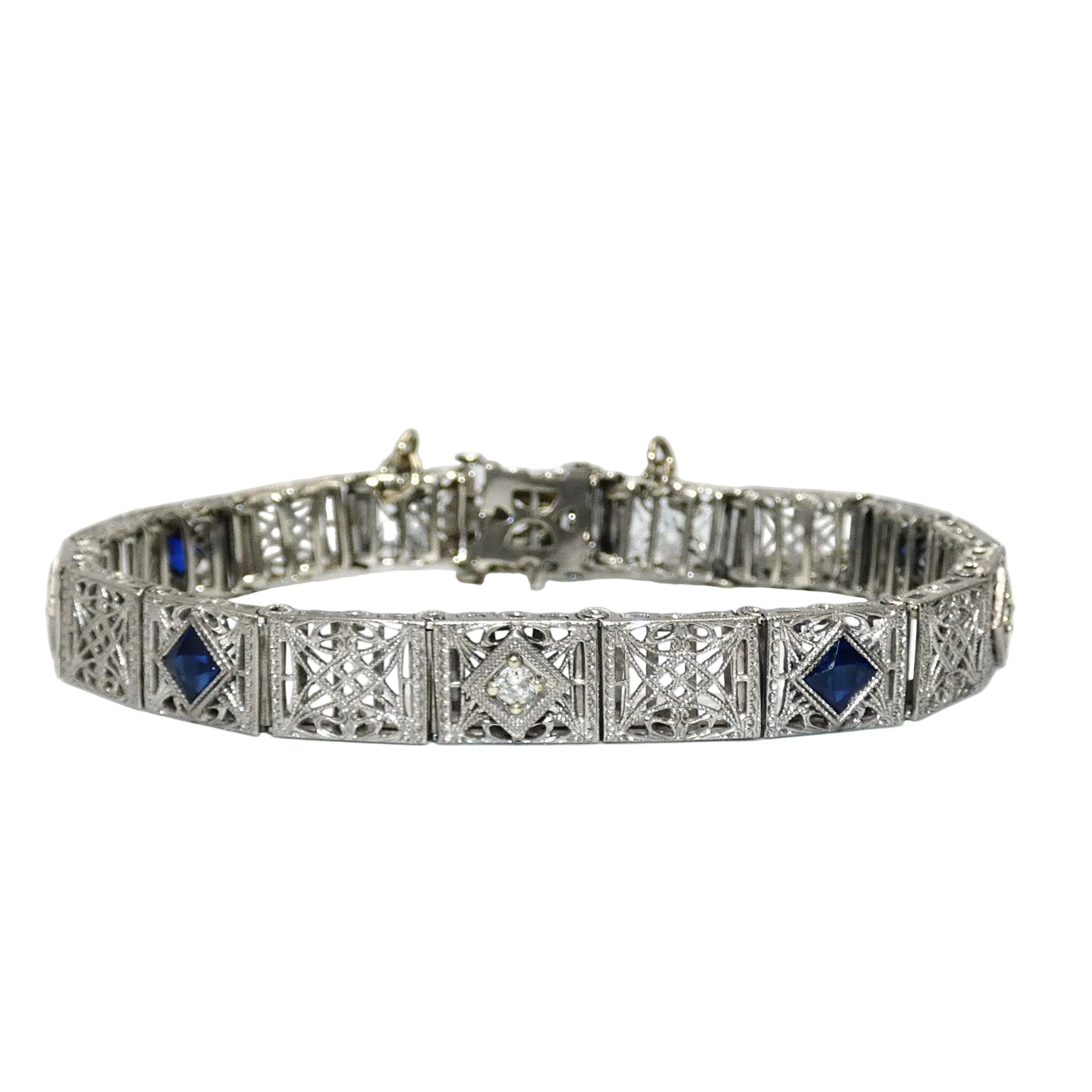 White gold bracelet with blue sapphires and diamonds on on a white background