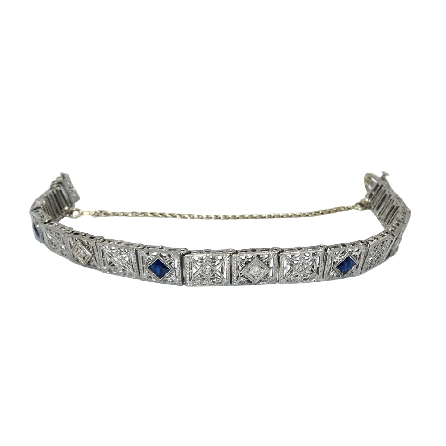 White gold bracelet with blue sapphires and diamonds on on a white background