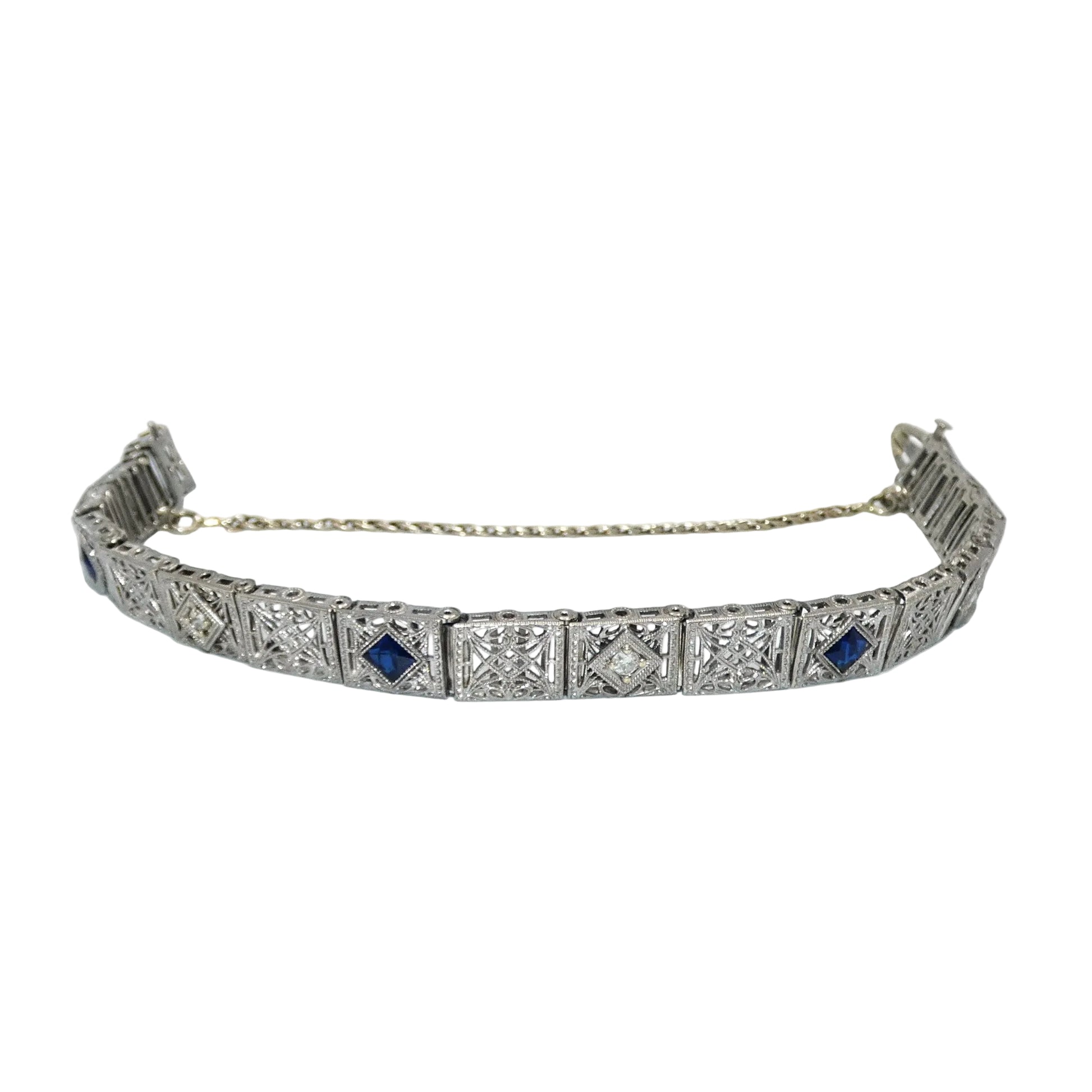 White gold bracelet with blue sapphires and diamonds on on a white background