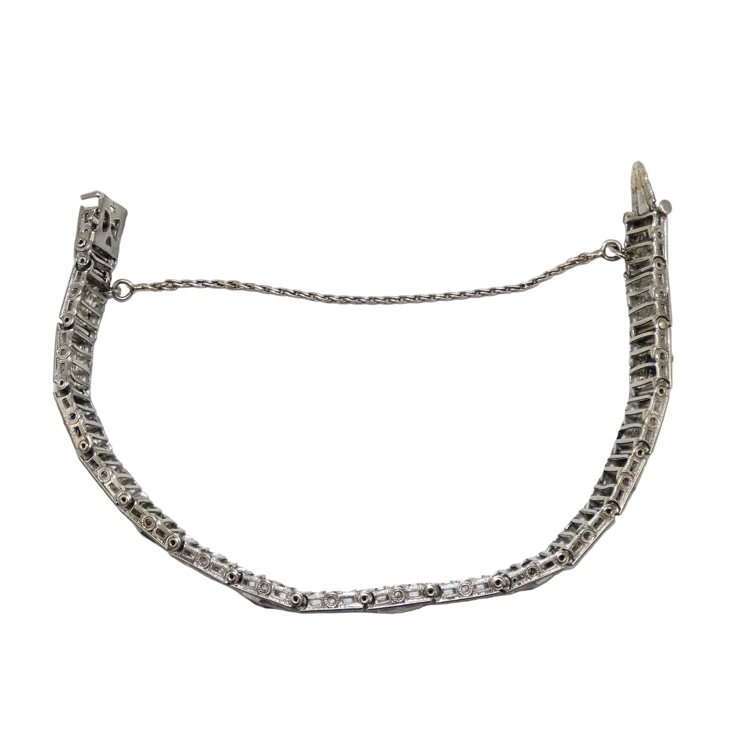 White gold bracelet with blue sapphires and diamonds on on a white background