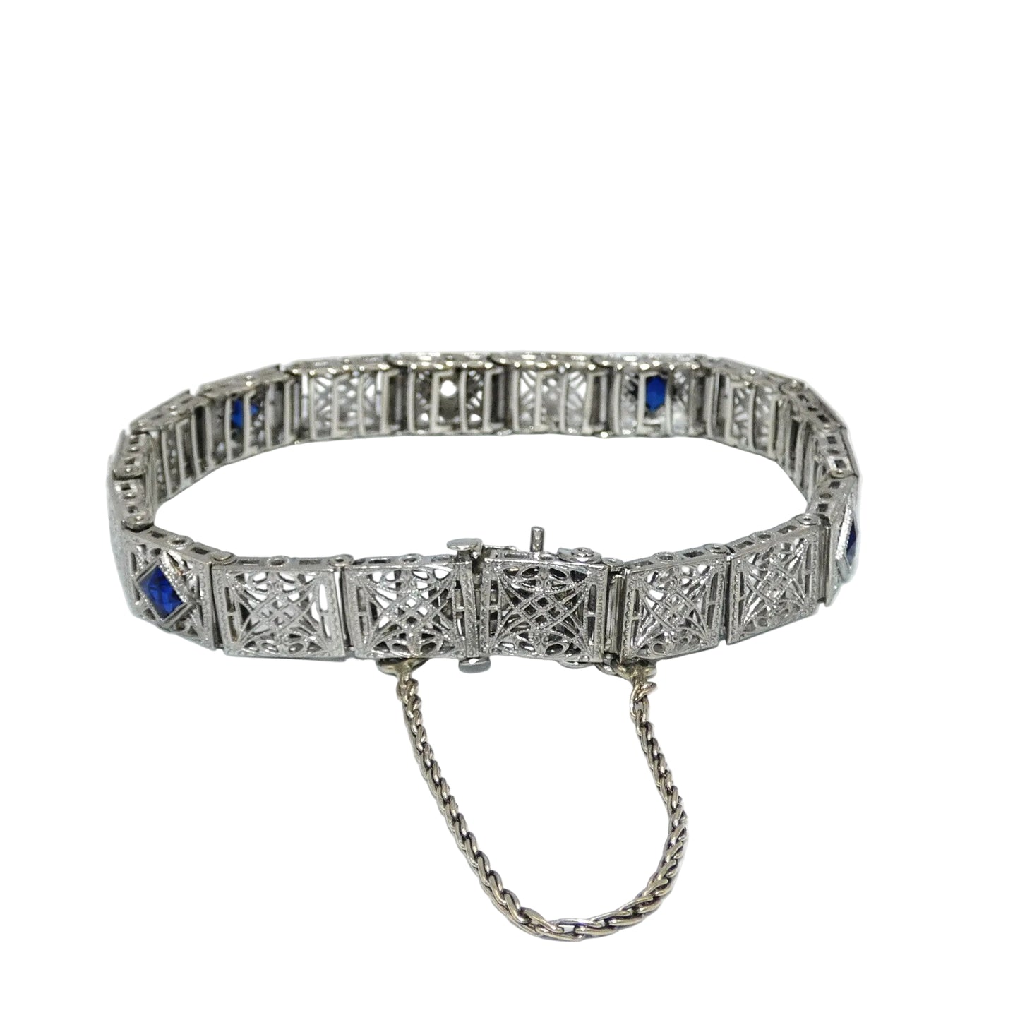 White gold bracelet with blue sapphires and diamonds on on a white background