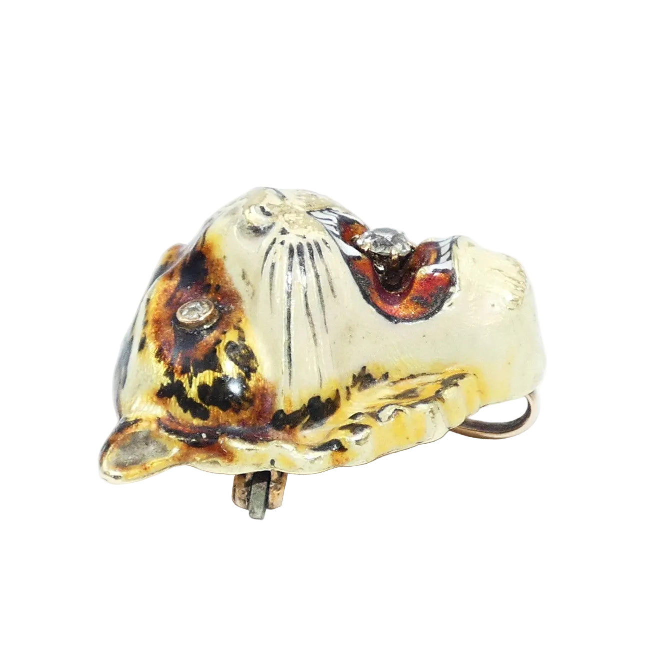 A tiger head brooch pin featuring a gold base with black and brown enamel stripes, a red interior, and diamond set in the eyes and mouth
