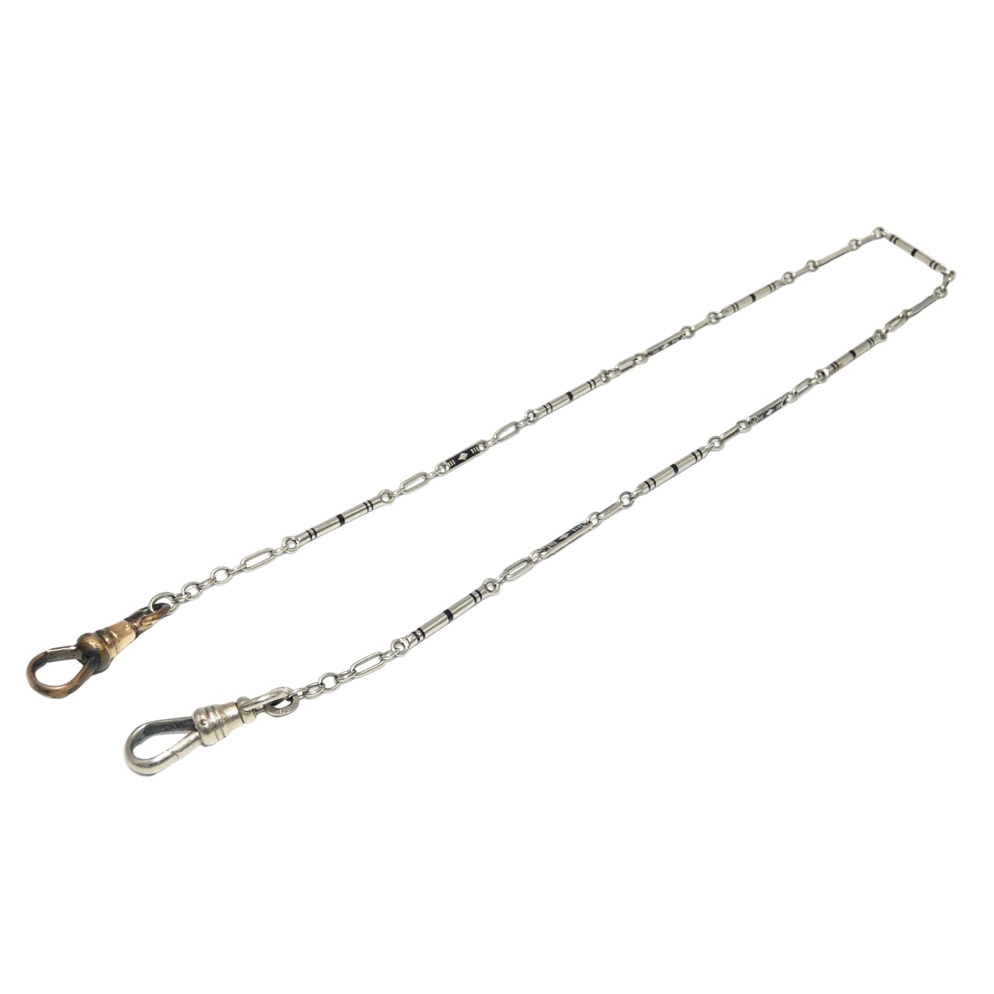 A 14k white gold pocket watch chain with a swivel snap hook on one end and a lobster clasp on the other