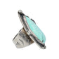 A sterling silver ring featuring a large, teardrop-shaped turquoise stone with natural white veining