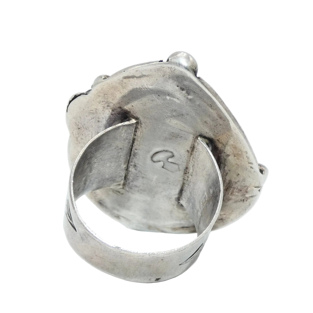 A sterling silver ring featuring a large, teardrop-shaped turquoise stone with natural white veining