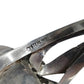 Close-up of a sterling silver cuff bracelet showing the engraved 'STERLING' mark 