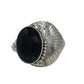 A silver cuff bracelet featuring a large, smooth onyx stone, set in an Art Deco style with scalloped and ribbed details
